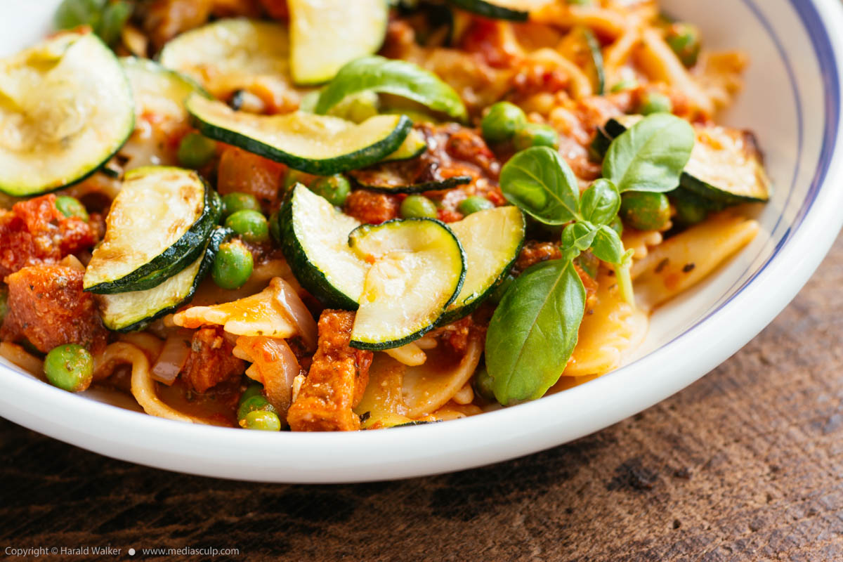 Stock photo of Pasta with Zucchini, Peas and Spicy Tofu Pieces