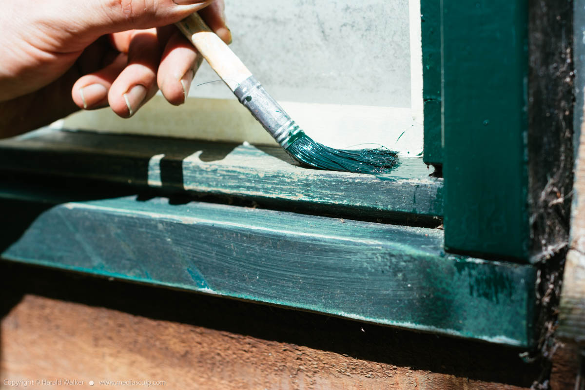 Stock photo of Painting a window frame