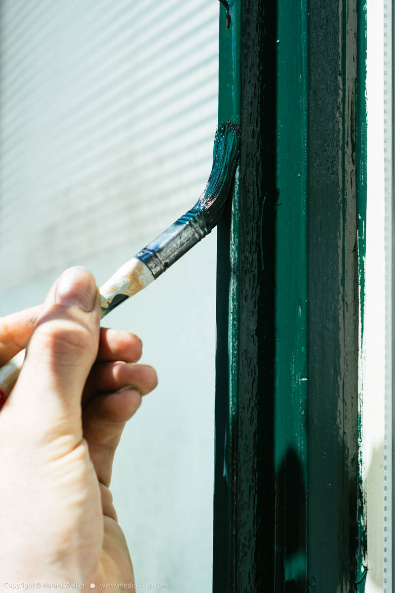 Stock photo of Painting a window frame