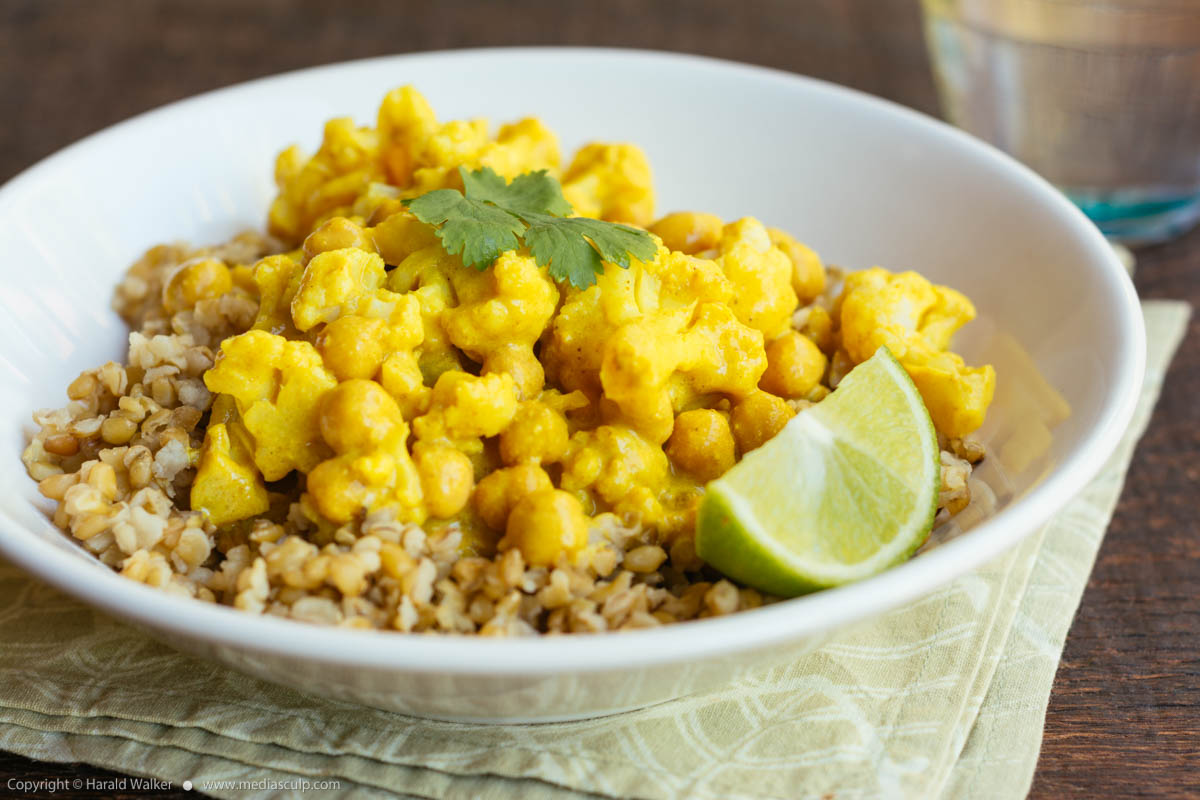 Stock photo of Curried Cauliflower and Chickpeas on Freekeh