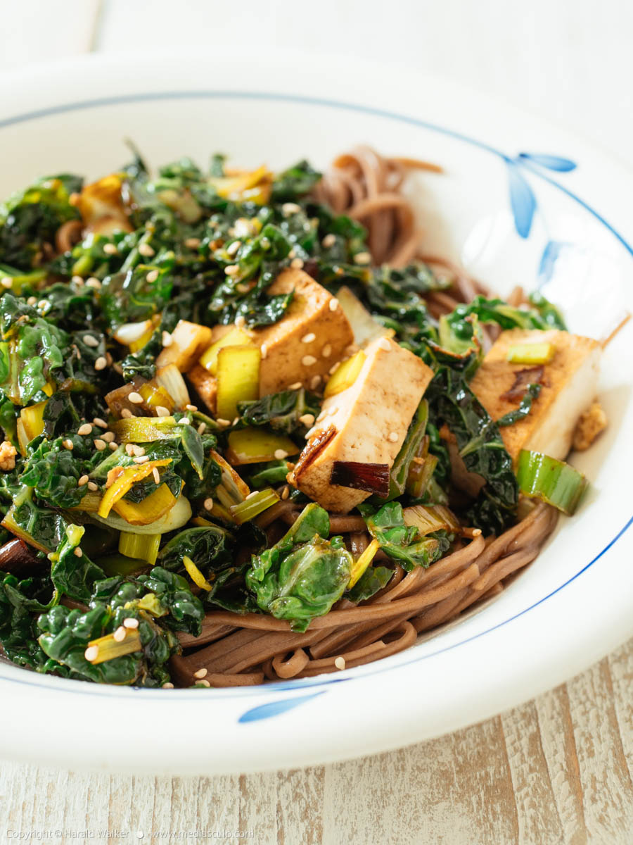 Stock photo of Stir-fry Savoy Cabbage with Tofu on Buckwheat Noodles