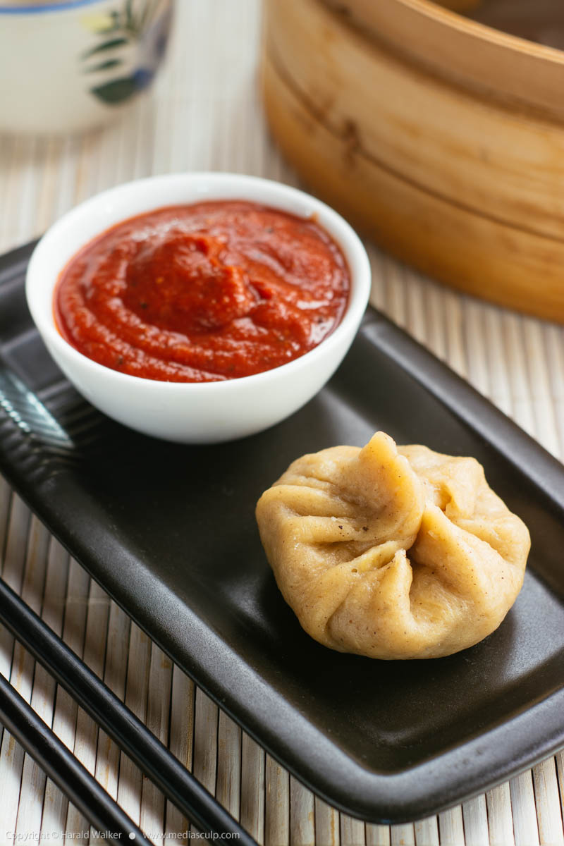 Stock photo of Chinese Dumplings with a Spice Tomato Sauce