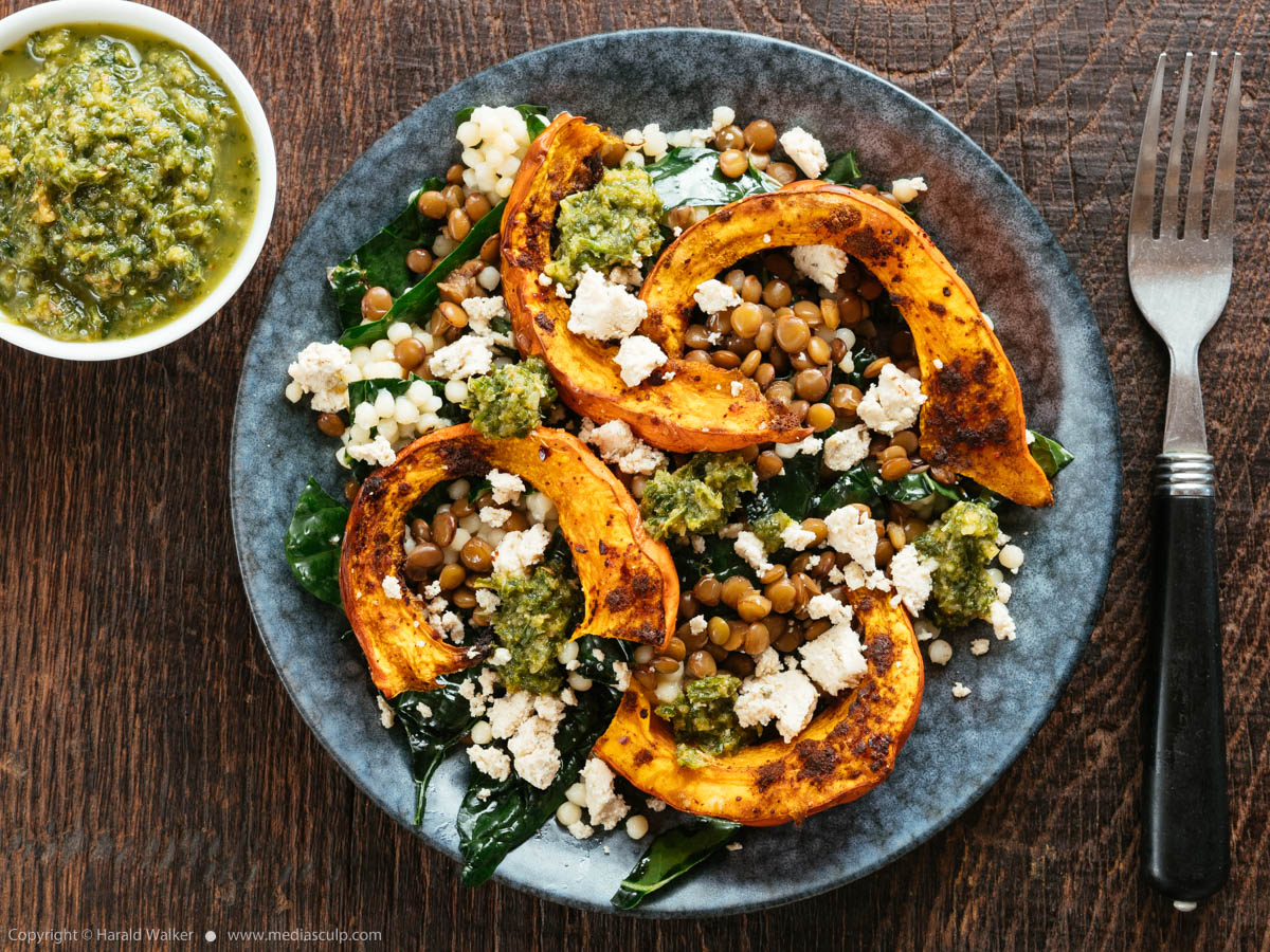 Stock photo of Roasted Squash On Couscous and Lentils with Kale