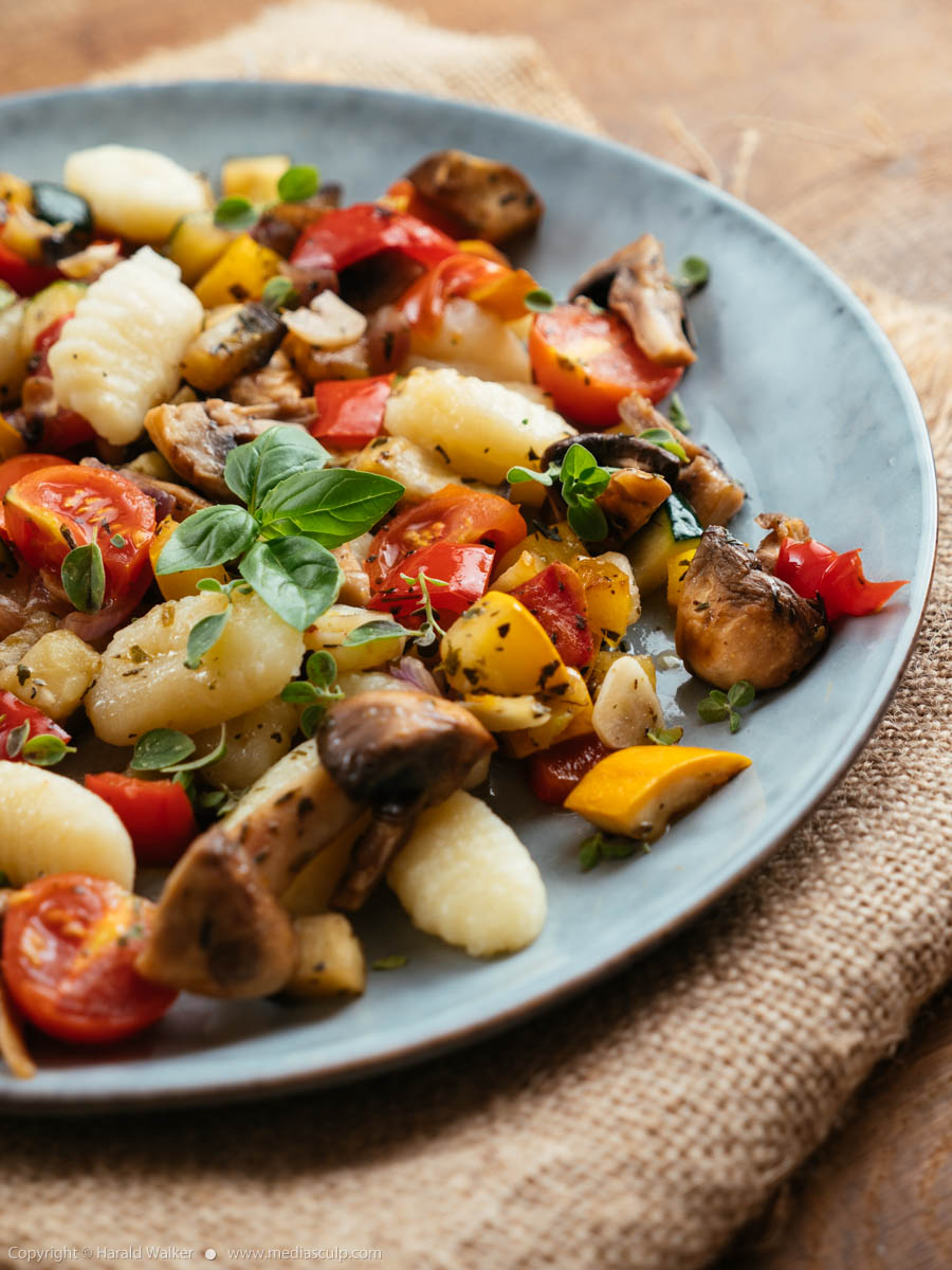 Stock photo of Gnocci with summer vegetables