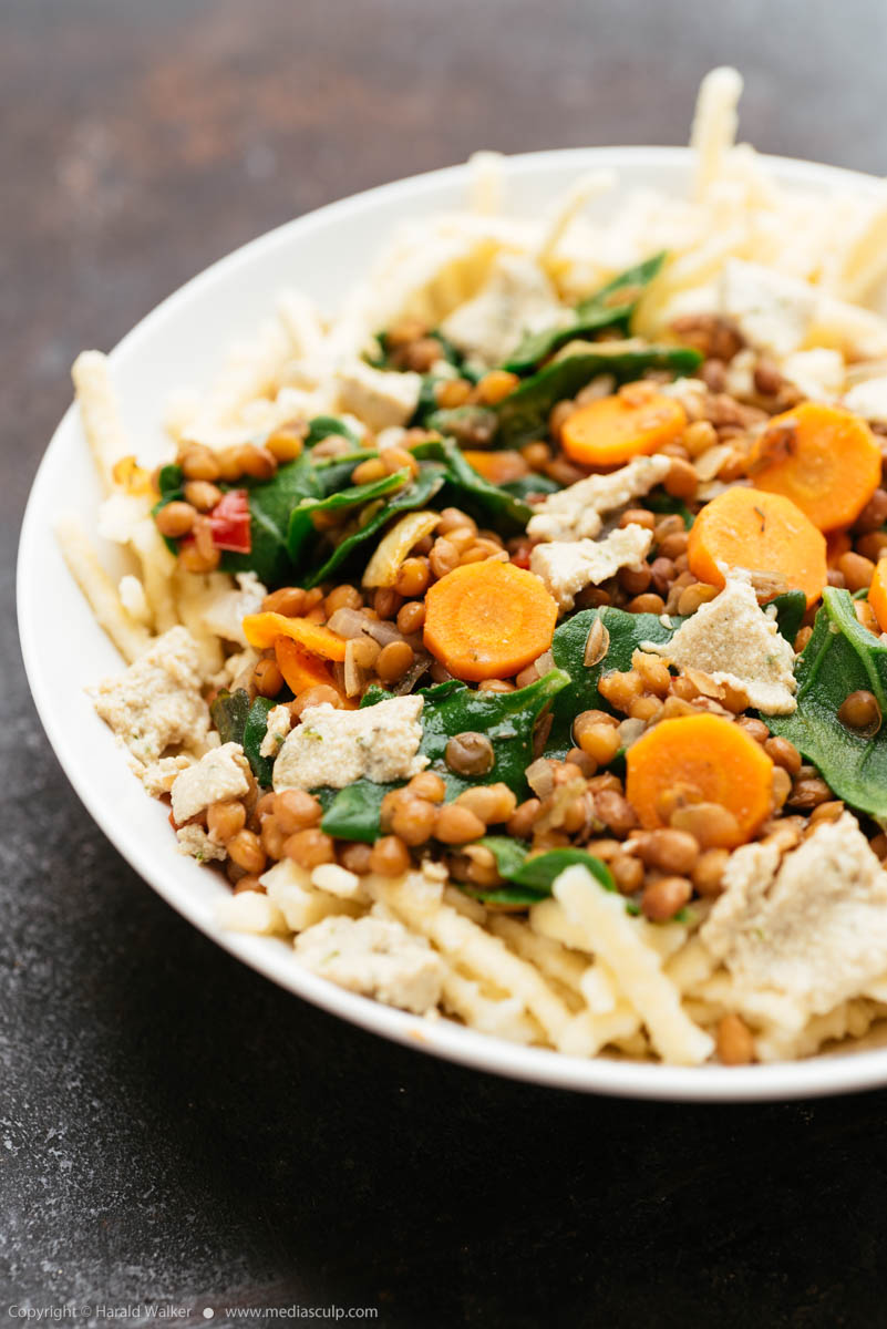Stock photo of Lentils with spinach and Vegan Feta on Spaetzle