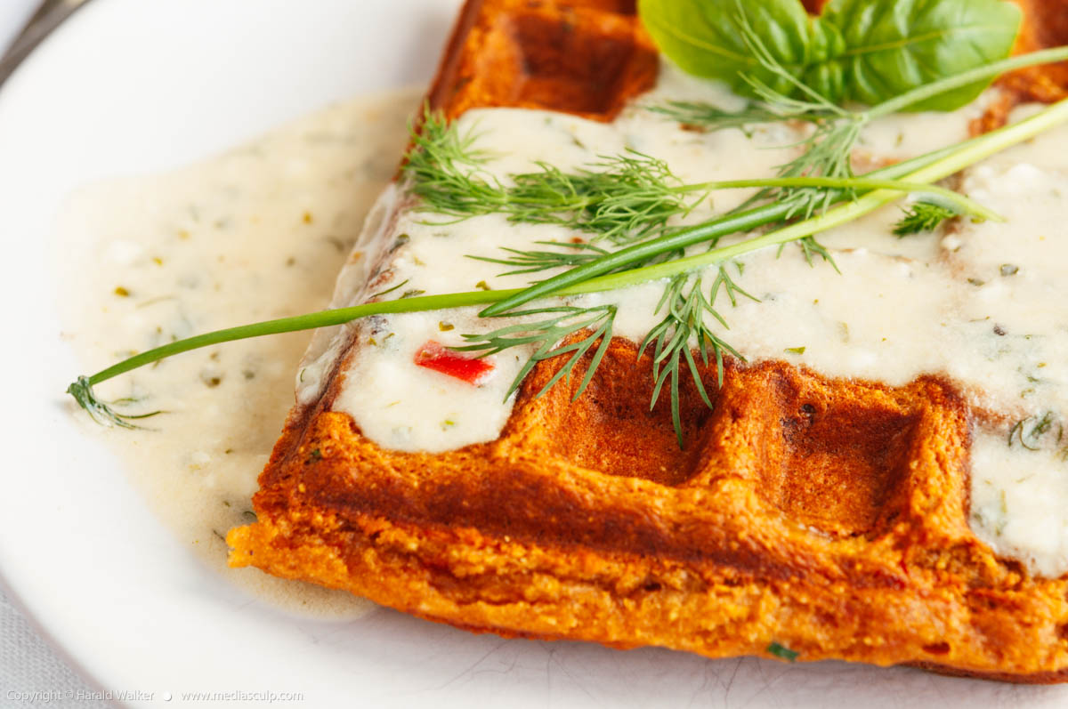 Stock photo of Bell Pepper Cornmeal Waffles with Herb Sauce