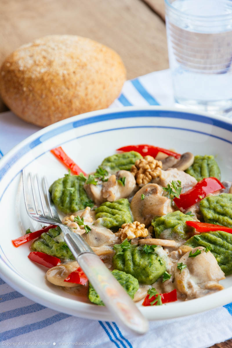 Stock photo of Spinach gnocchi with mushrooms and bell pepper