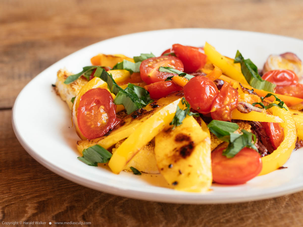 Stock photo of Tropical Cornmeal Crusted Tofu with Peppers and Mango