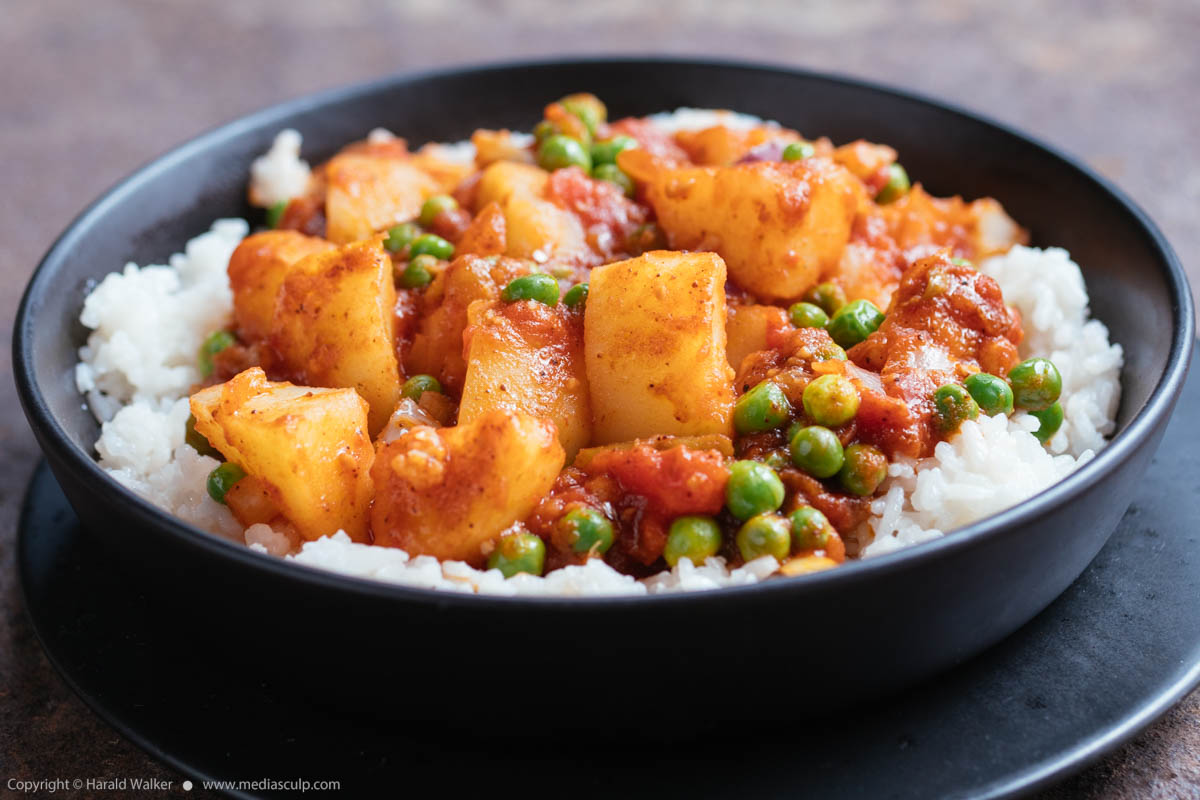 Stock photo of Potato and Pea Curry on Rice
