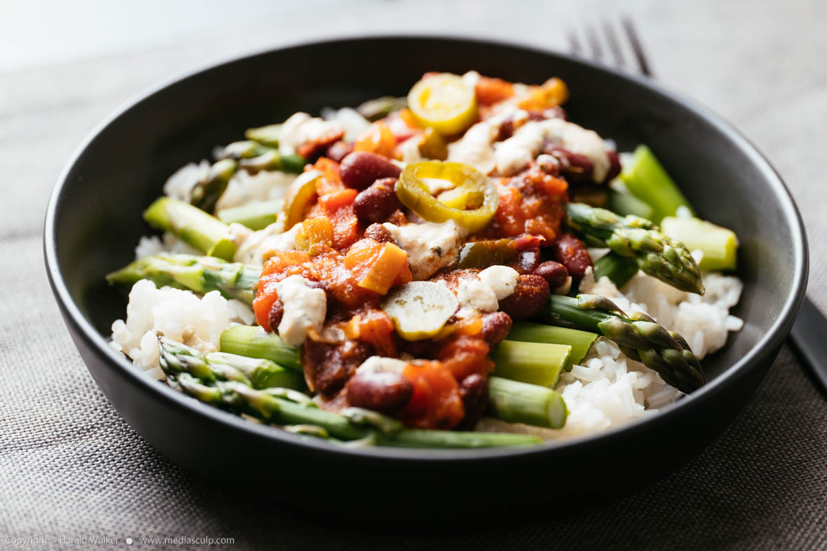 Stock photo of Fresh Asparagus with Mexican Sauce on Rice