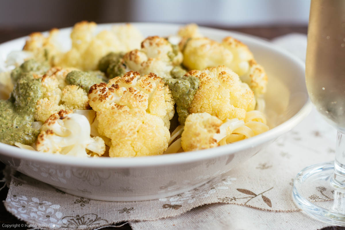 Stock photo of Roasted Cauliflower on Pasta with Arugula Walnut Pesto