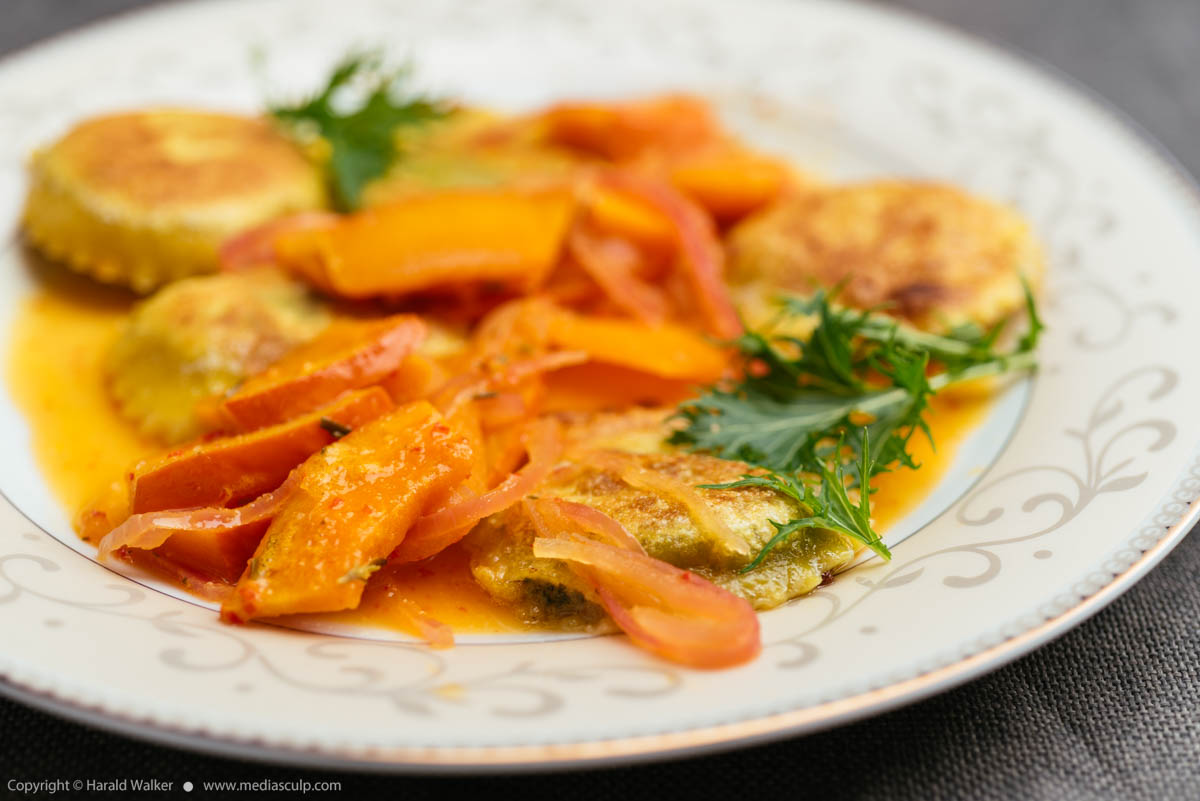 Stock photo of Rucola Pesto Ravioli in Pumpkin, Orange Sauce