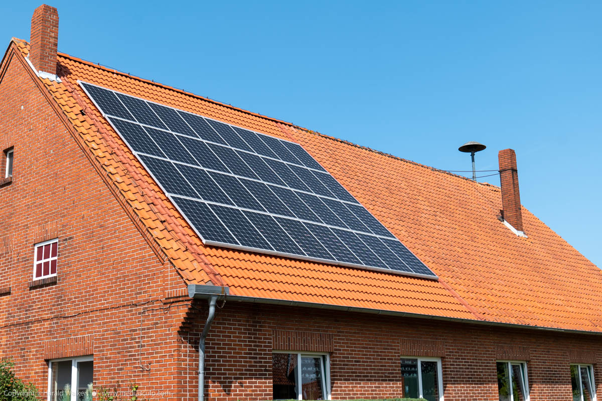 Stock photo of Old house with solar panels