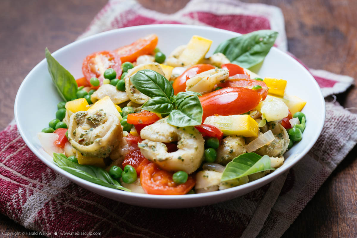 Stock photo of Summertime Vegetables with Vegan Basil Pesto on Tortellini
