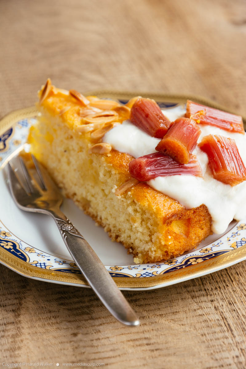 Stock photo of Vegan Orange, Almond Semolina Cake with Baked Rhubarb