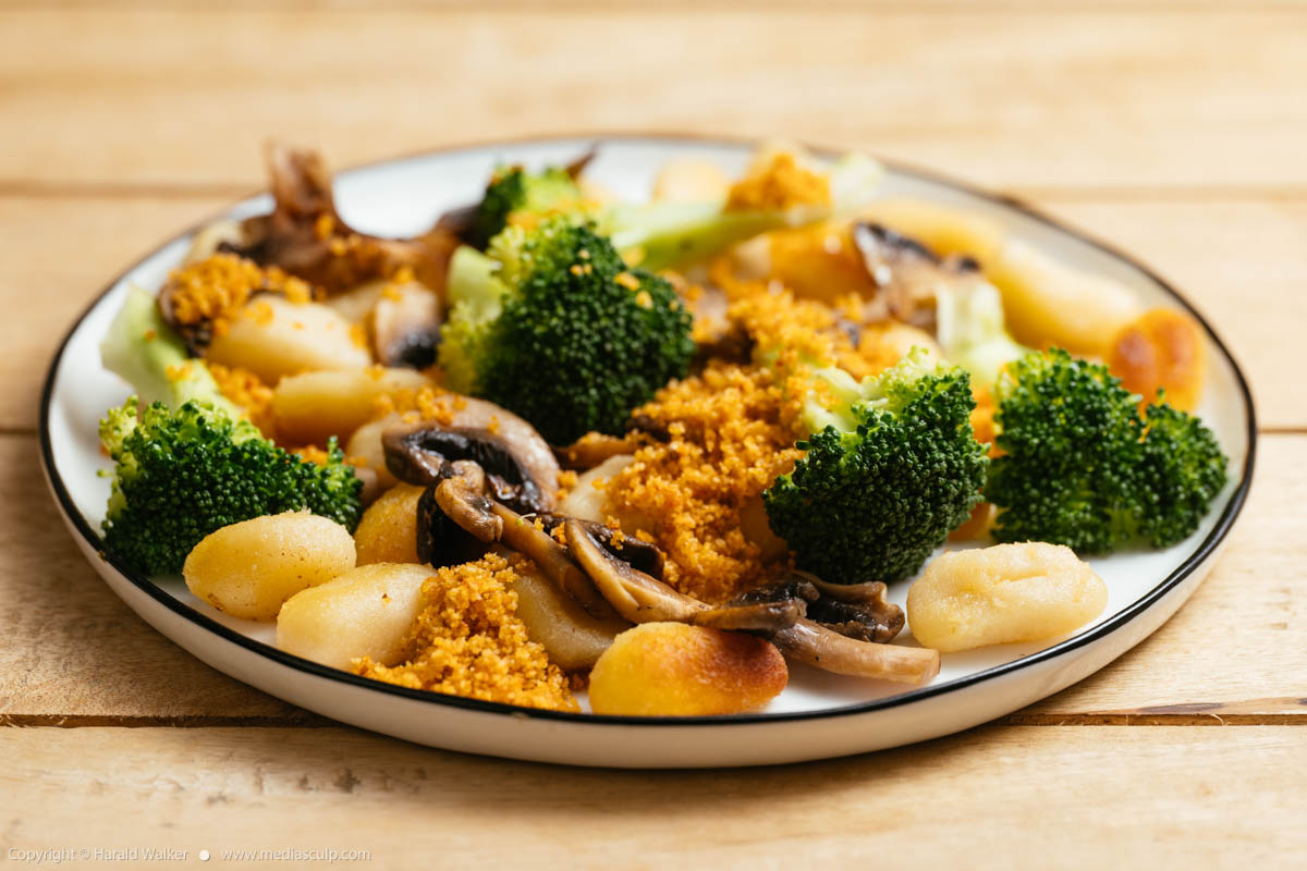 Stock photo of Gnocchi with Mushrooms Broccoli and Spicy Bread Crumbs