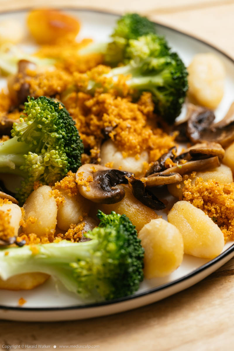 Stock photo of Gnocchi with Mushrooms Broccoli and Spicy Bread Crumbs