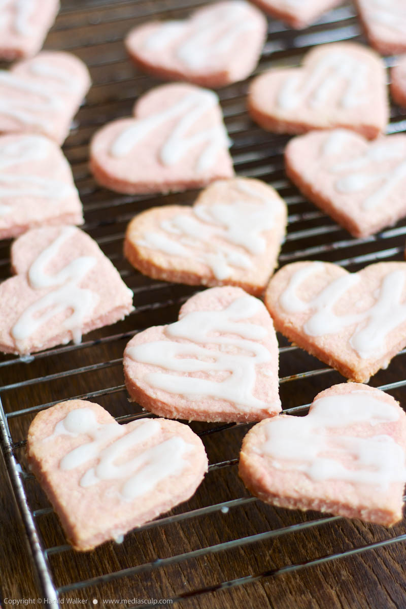 Stock photo of Pink heart shaped coconut cookies